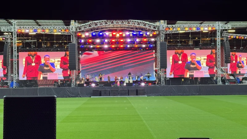 NSPPD live production at Old Trafford with the temporary stage, suspended sound, lighting and large video screens