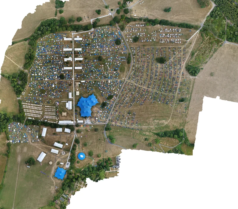 Aerial view of the Wildfires 2026 site with extensive camping, car parks and large temporary event venues